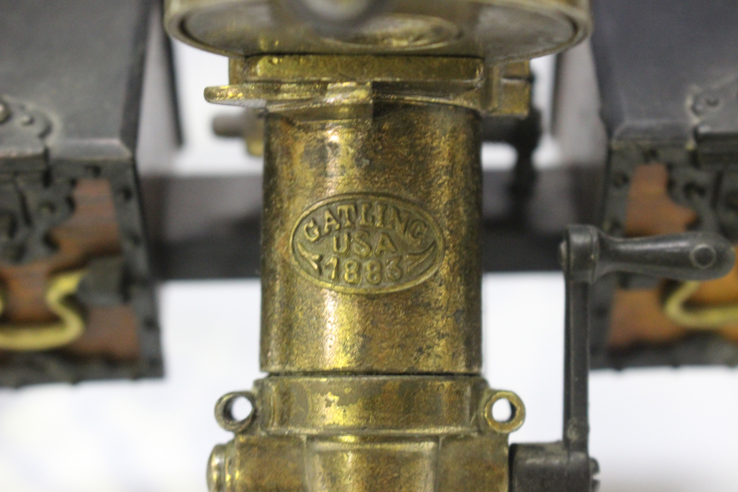 A late 20th century cast metal and wooden desk model of Gatling gun, mounted on a wheeled - Image 3 of 4