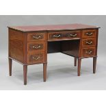 An Edwardian mahogany twin pedestal desk, fitted with seven drawers, height 77cm, width 137cm, depth