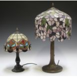 A modern Tiffany style table lamp with a stained and leaded glass domed shade, height 53cm, together