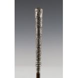 A late Victorian palmwood walking cane with a foliate decorated silver handle, Birmingham 1880,