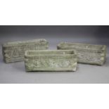 A set of three late 20th century cast composition stone rectangular garden planters, the sides