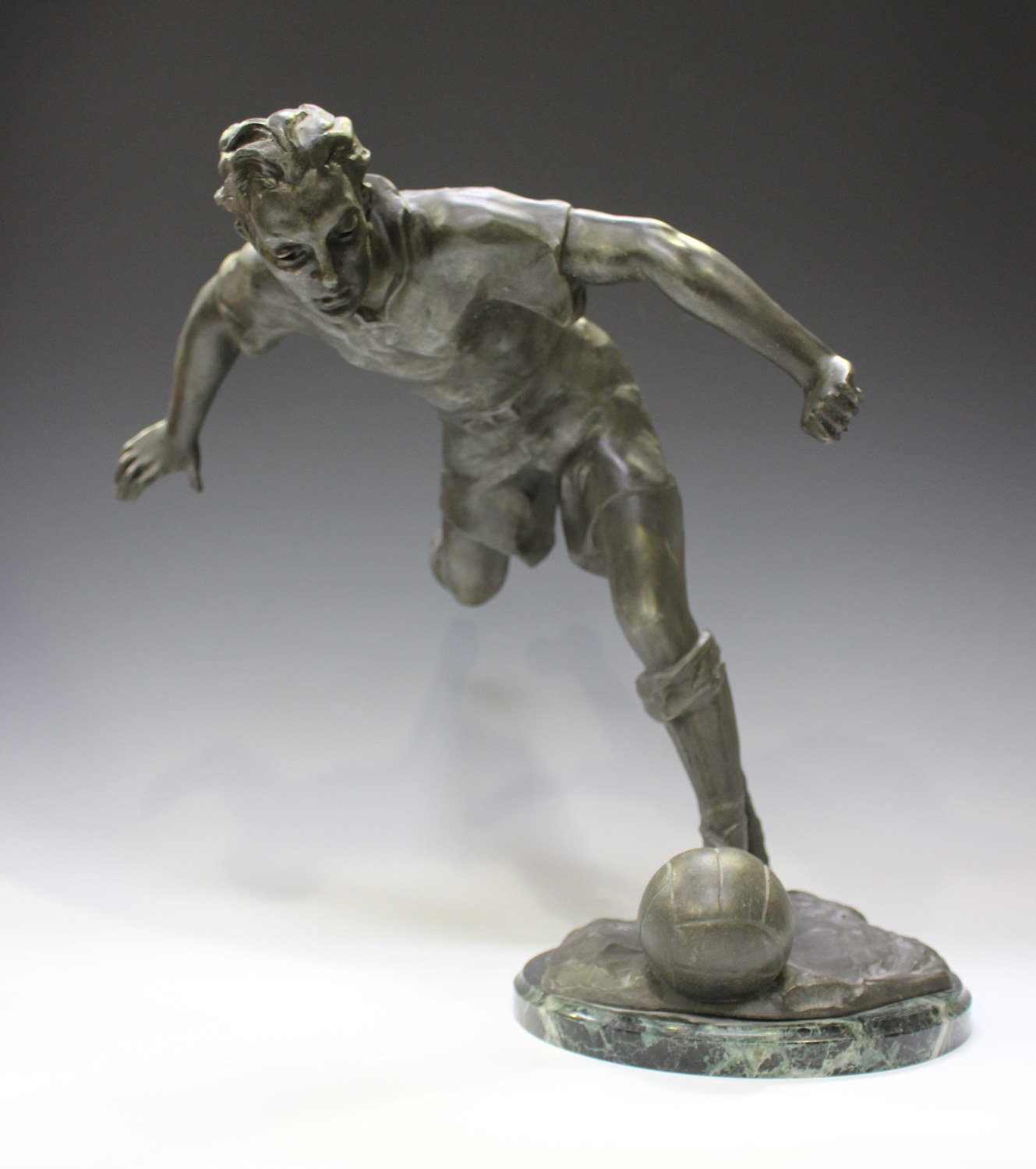 Lemoyne - a French patinated spelter figure of a footballer about to strike a ball, the base bearing - Image 5 of 6