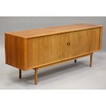 A mid-20th century Danish teak sideboard, designed by Jens Quistgaard for Peter Long, the tambour
