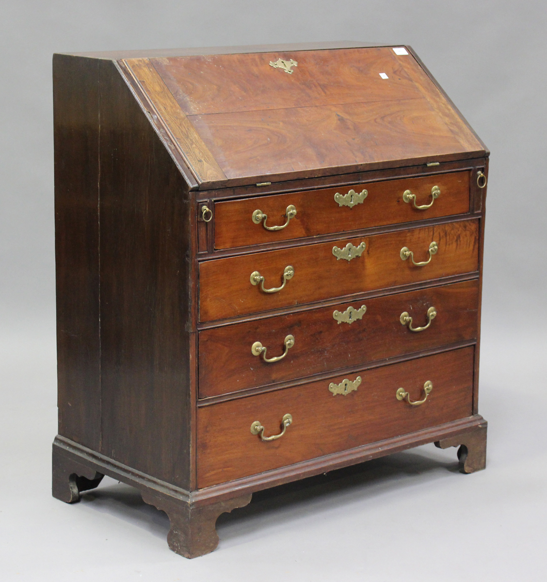 A George III mahogany bureau, the fall-front above four long drawers, on bracket feet, height 101cm,