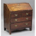 A George III mahogany bureau, the fall-front revealing a fitted interior above two short and two