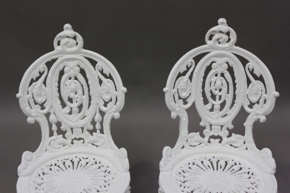 A pair of late Victorian white painted cast iron garden chairs of foliate scroll form, height - Image 4 of 4