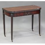 A George III mahogany tea table with hinged top, the frieze decorated with stiff leaf sprays and