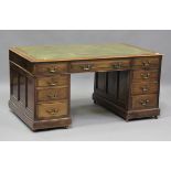A good Edwardian walnut twin pedestal desk, possibly by Maple & Co, the top inset with green leather