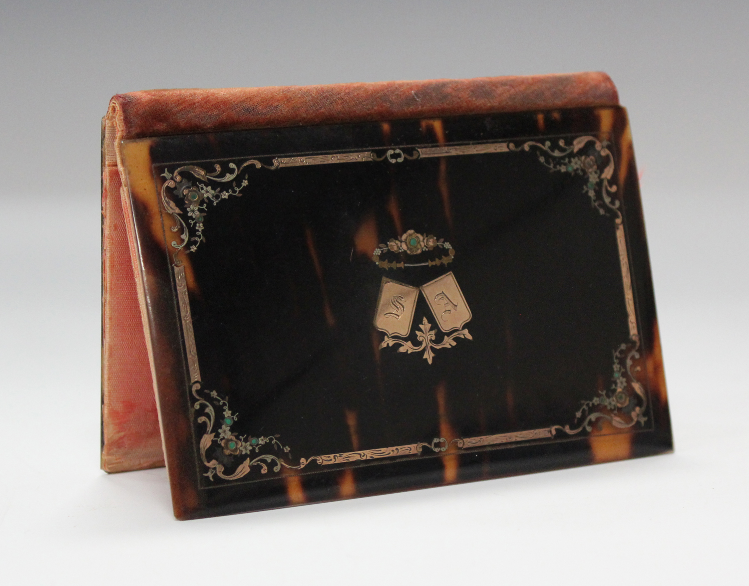 A late 19th century tortoiseshell and gold inlaid folding aide-mémoire, the cover initialled 'SA',