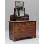 An Edwardian walnut dressing chest, fitted with a swing frame mirror, height 157cm, width 107cm,