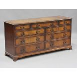 A late 20th century reproduction mahogany chest of ten drawers, height 77cm, width 153cm, depth
