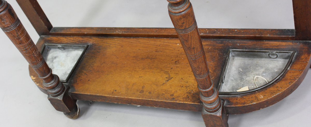 A late Victorian oak hallstand with carved foliate decoration, fitted with a drawer, on turned - Image 3 of 6