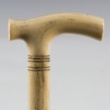 A mid-Victorian whalebone and ivory scrimshaw walking cane, length 82cm.Buyer’s Premium 29.4% (