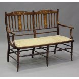 An Edwardian mahogany and foliate inlaid salon settee, height 94cm, width 128cm, depth 57cm.Buyer’