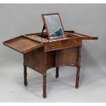 A good George III figured mahogany dressing table with double-hinged top, revealing a fitted