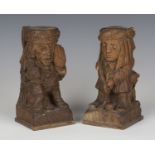 A pair of early 20th century carved oak finials of golfing interest, modelled as a golfer and