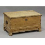 A late 19th century pine trunk, the hinged lid revealing a candlebox, height 50cm, width 96cm, depth