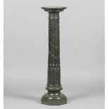 A late 19th/early 20th century green serpentine marble three-section pedestal, the circular top