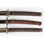 A group of three modern ornamental samurai swords, all with decorative mounts and watered-effect