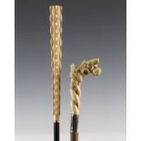 An Edwardian mahogany walking cane, the ivory handle finely carved as a thorny branch with roses and