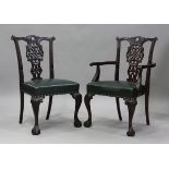 A set of ten late 19th/early 20th century Chippendale style mahogany dining chairs with pierced