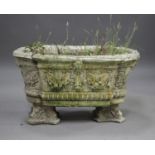 A late 20th century cast composition stone shaped garden planter, the sides decorated in relief with