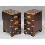 A pair of 20th century hardwood and brass bound campaign style bedside chests, height 62cm, width