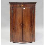A George III mahogany hanging bowfront corner cabinet with boxwood stringing, height 109cm, width