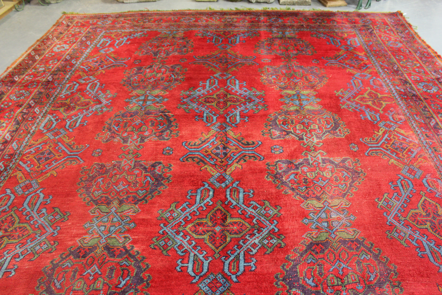 A large Turkish 'Old Turkey' carpet, early 20th century, the red field with overall palmettes and - Image 7 of 11