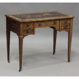 A late Victorian rosewood writing table with boxwood foliate and line inlaid decoration, height