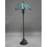 A modern anodized metal lamp standard, fitted with a large Tiffany style stained and leaded glass