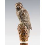 A late 19th century Malacca walking cane, the boxwood handle carved as a bird perched on a leaf