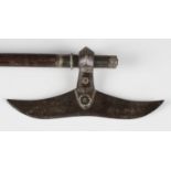 A 19th century Middle Eastern steel headed and white metal mounted battle axe, mounted on a hardwood