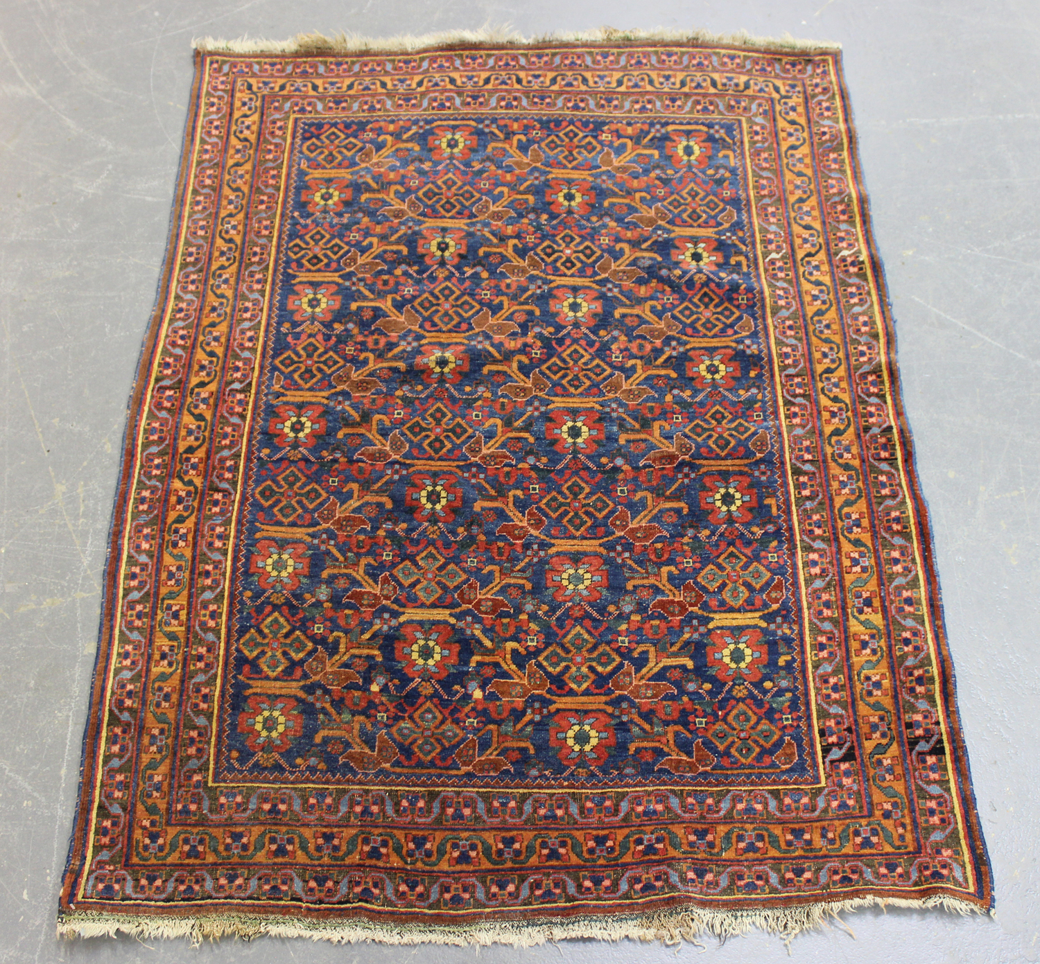 An Afshar rug, South-west Persia, early 20th century, the blue field with an overall bold floral