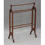 A late Victorian mahogany towel rail, each end fret cut with a fleur-de-lis, height 96cm, width