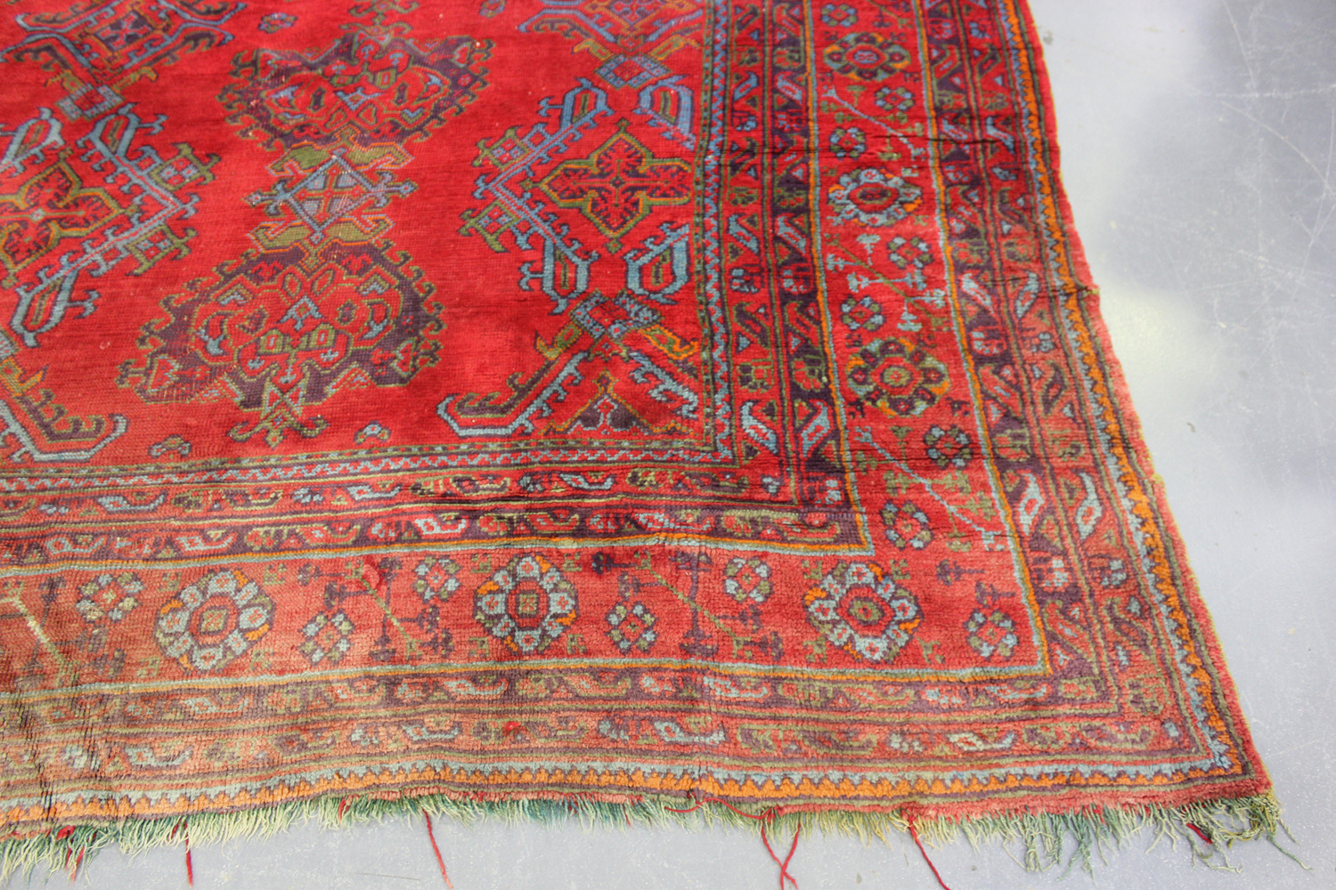 A large Turkish 'Old Turkey' carpet, early 20th century, the red field with overall palmettes and - Image 2 of 11