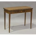 A George III mahogany rectangular fold-over tea table, the frieze with inlaid shell patera, on