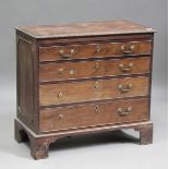 A George III mahogany bachelor's chest of four oak-lined drawers, fitted with a brushing slide,