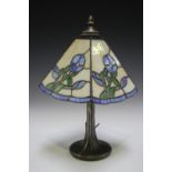 A modern Tiffany style table lamp with stained and leaded glass shade, height 38cm.Buyer’s Premium