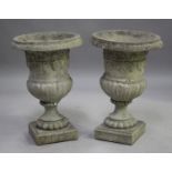 A pair of late 20th century cast composition stone garden urns of half-reeded campana form, height