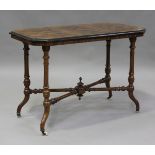 A mid-Victorian burr walnut stretcher table, the canted top on turned and fluted legs with china