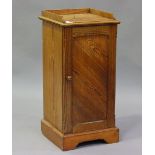 An early 20th century pitch pine bedside cupboard, height 83cm, width 39cm, depth 38cm.Buyer’s