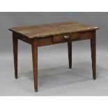 A mid-20th century oak and mahogany writing table, fitted with a single drawer, on tapering block