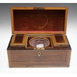 A George III rosewood tea caddy with inlaid running scroll borders and applied gilt metal phoenix