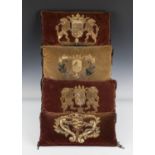 A group of four velvet cushions, purportedly made for the 1953 Coronation and applied with 17th
