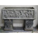 A late 20th century cast composition stone rectangular garden planter, the sides decorated in relief