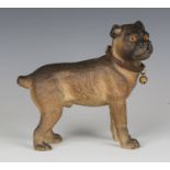 A Continental painted terracotta model of a dog with inset glass eyes and leather collar, length