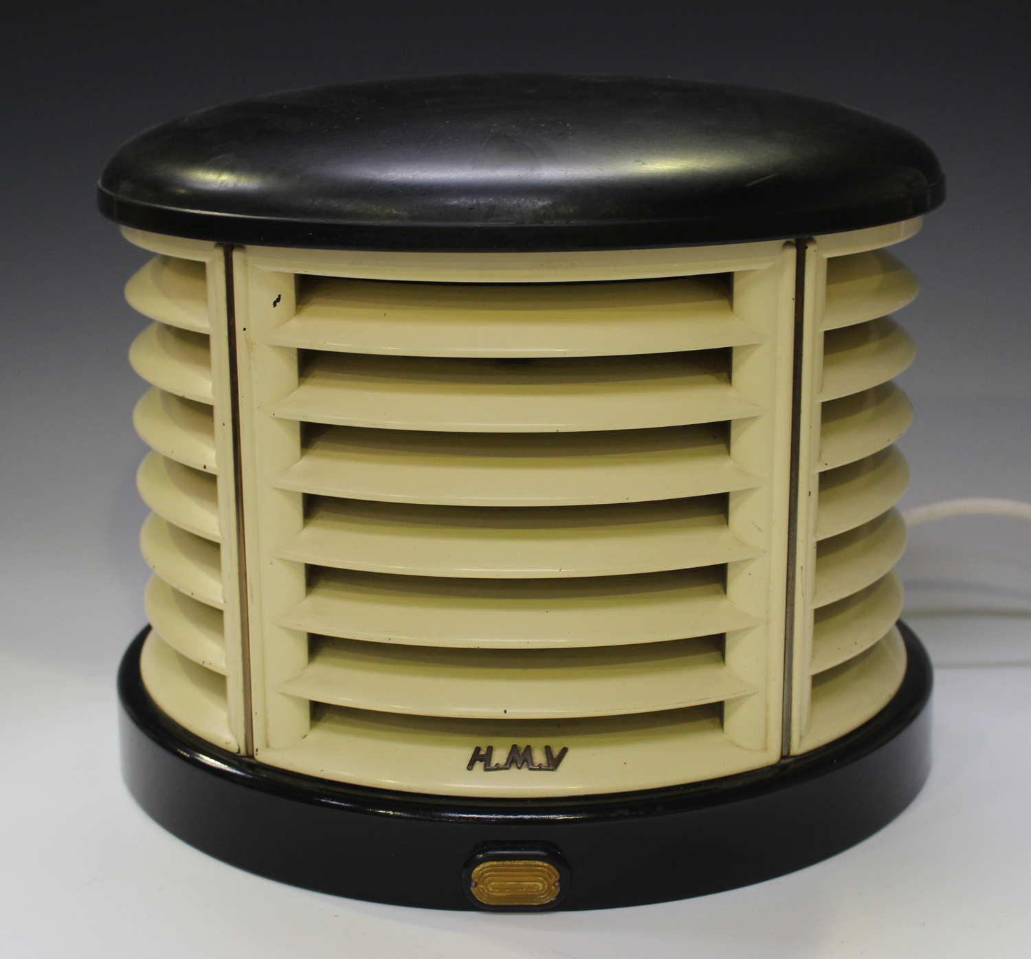 An HMV black and cream Bakelite portable heater, width 33cm.Buyer’s Premium 29.4% (including VAT @