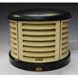 An HMV black and cream Bakelite portable heater, width 33cm.Buyer’s Premium 29.4% (including VAT @