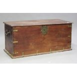 A large late 19th century Middle Eastern teak and brass bound trunk, the hinged lid above